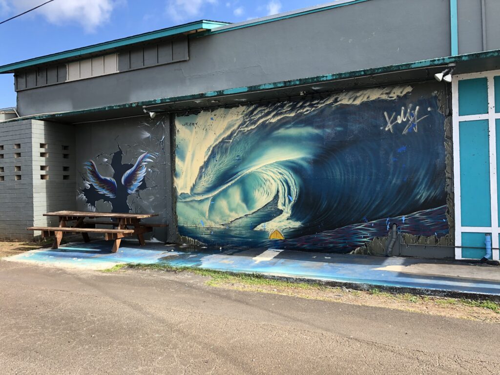 On the left side of North Shore Surf Shop is this mural and pair of wings. Take a picture here and share it on your social media. 