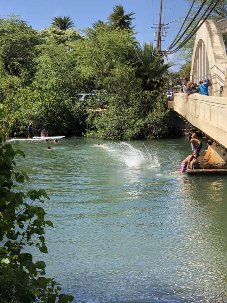 The local kids from Haleiwa and surrounding area love to jump off Rainbow bridge to cool down. 