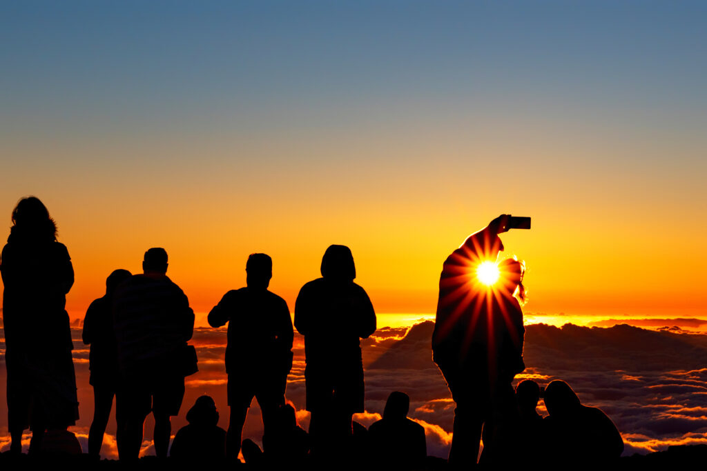 Wake up early and watch the sunrise on the top of the Haleakala Crater on the Island of Maui. It's an amazing sight to see. 