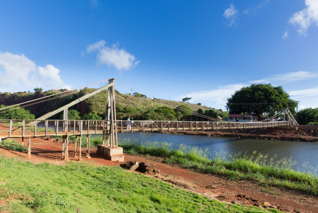 When on the Island of Kauai, drive to the little town of Hanapepe and cross this swinging bridge. 